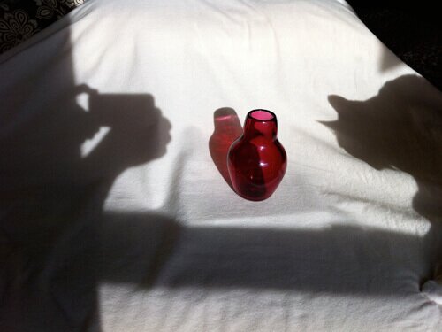 Blown glass vessel, and a cat silhouette
